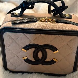 Chanel Filigree Vanity Beige and Black Bag in size small. Excellent condition